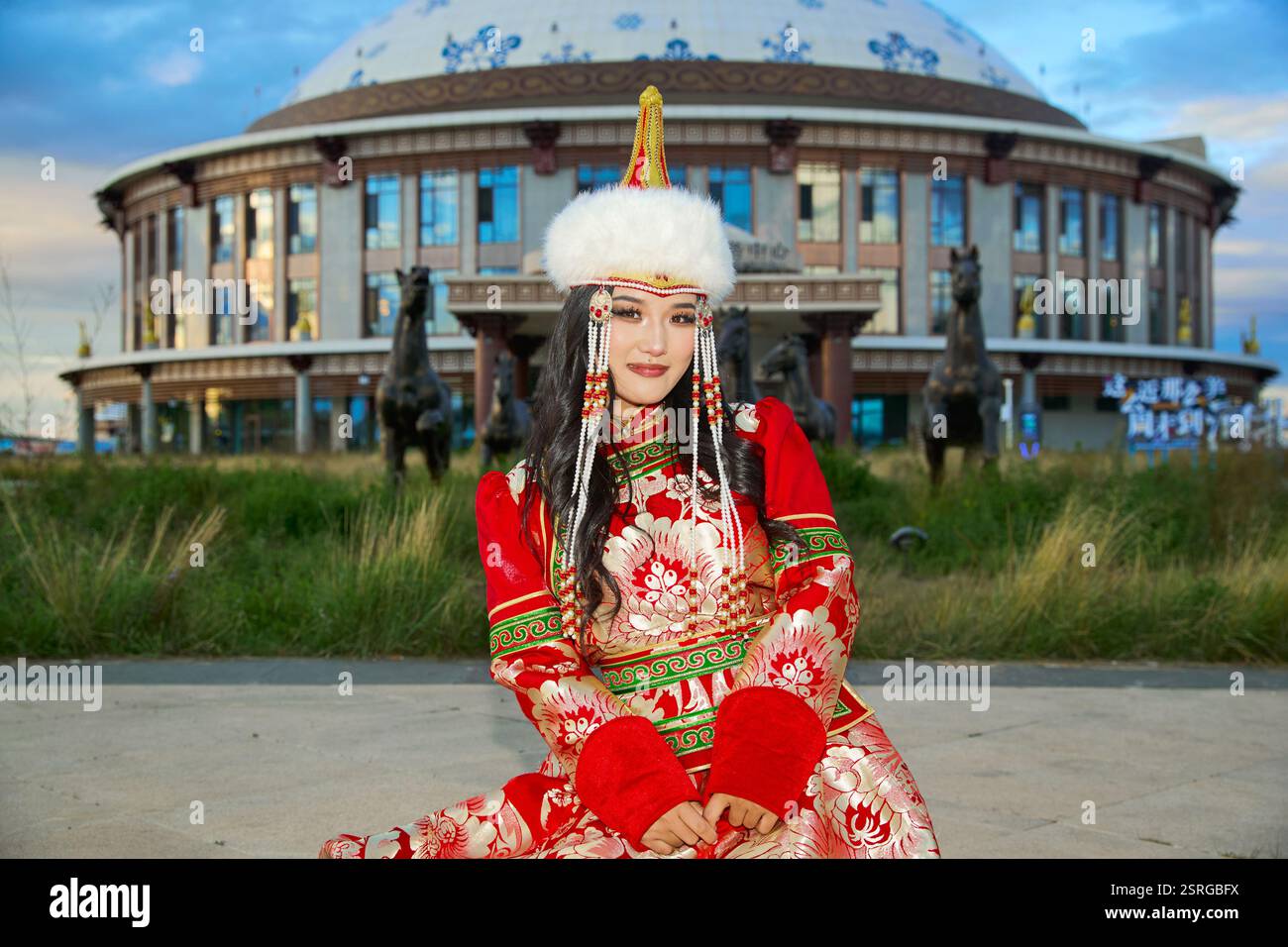 Mongolian girl wearing traditional costume of the Mongolian Ordos tribe ...