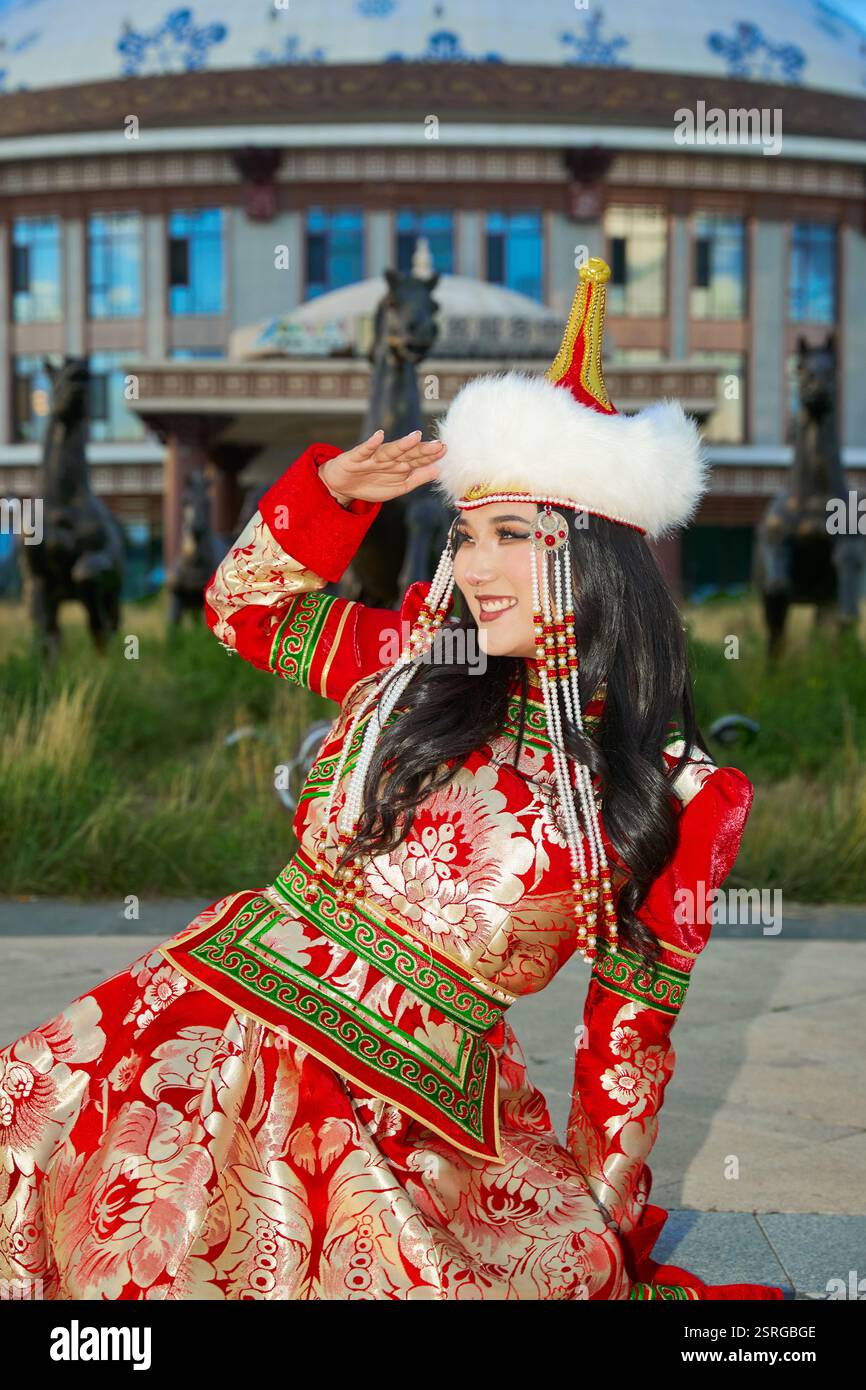 Mongolian girl wearing traditional costume of the Mongolian Ordos tribe ...