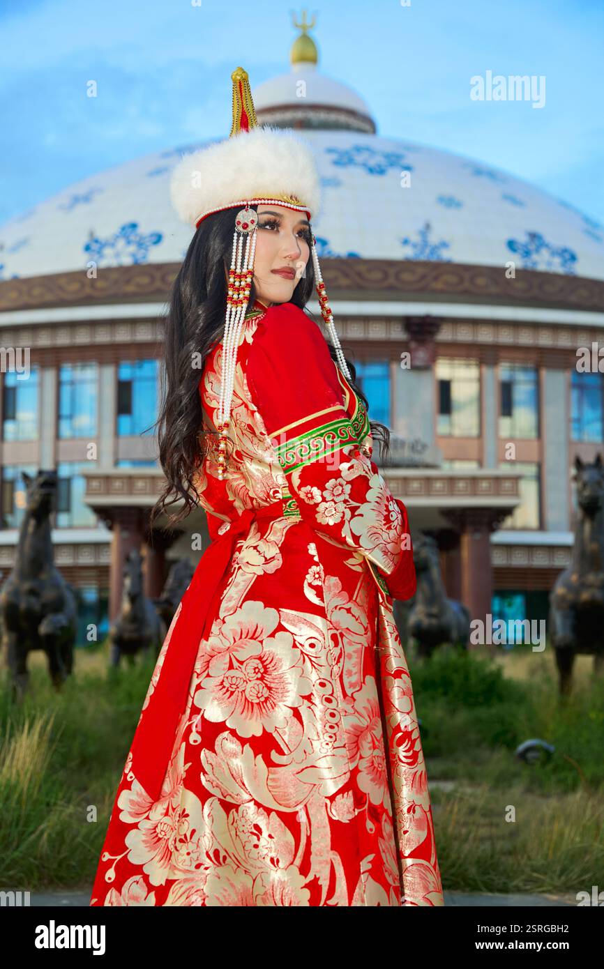 Mongolian girl wearing traditional costume of the Mongolian Ordos tribe ...