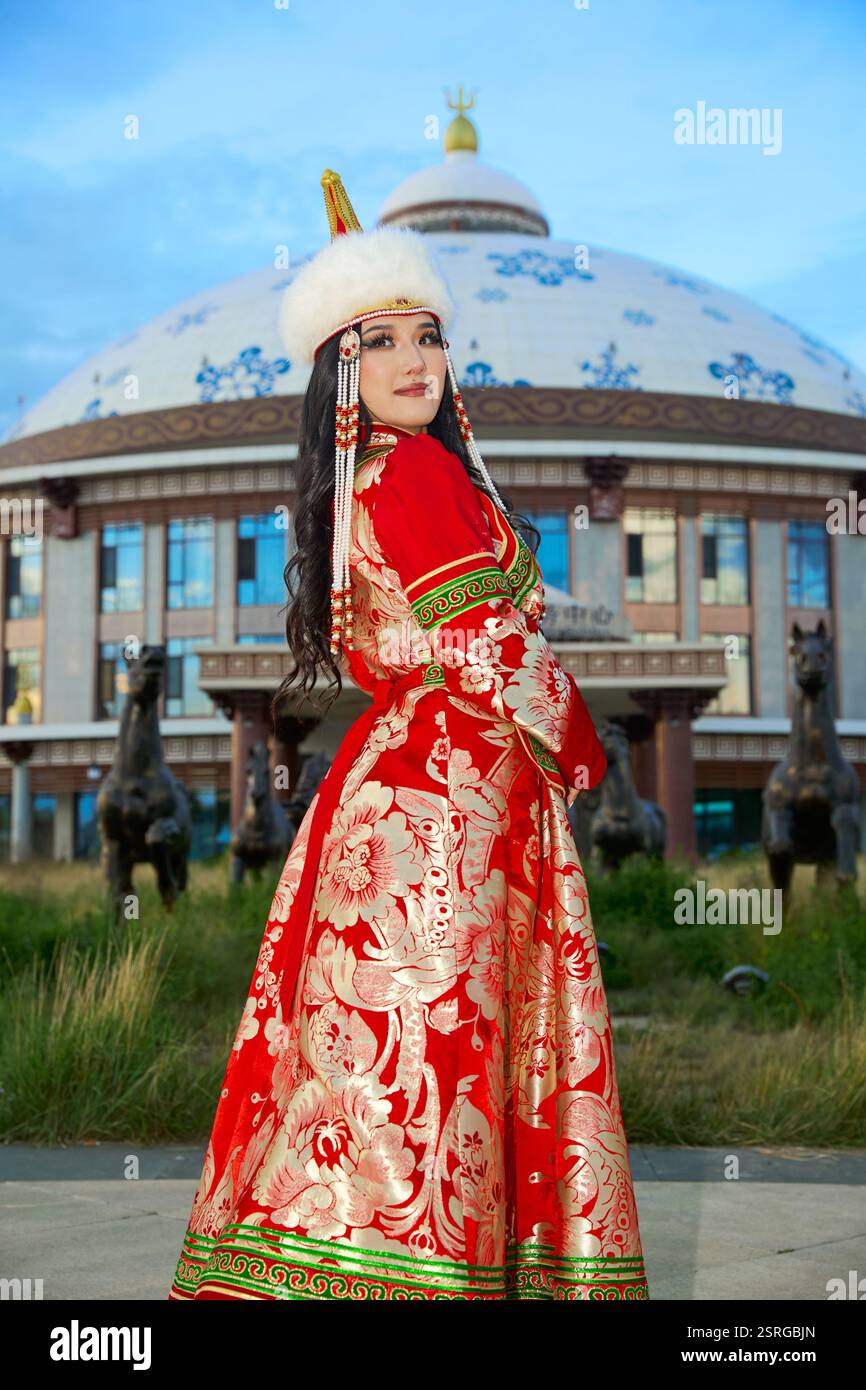 Mongolian girl wearing traditional costume of the Mongolian Ordos tribe ...