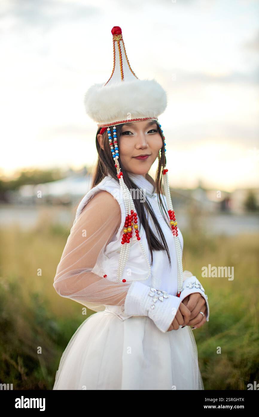 Mongolian girl wearing traditional costume of the Mongolian Ordos tribe ...