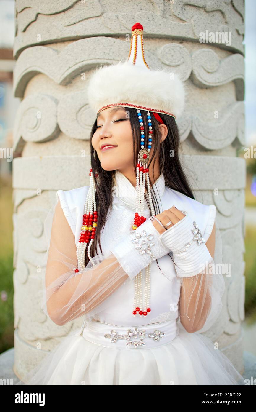 Mongolian girl wearing traditional costume of the Mongolian Ordos tribe ...