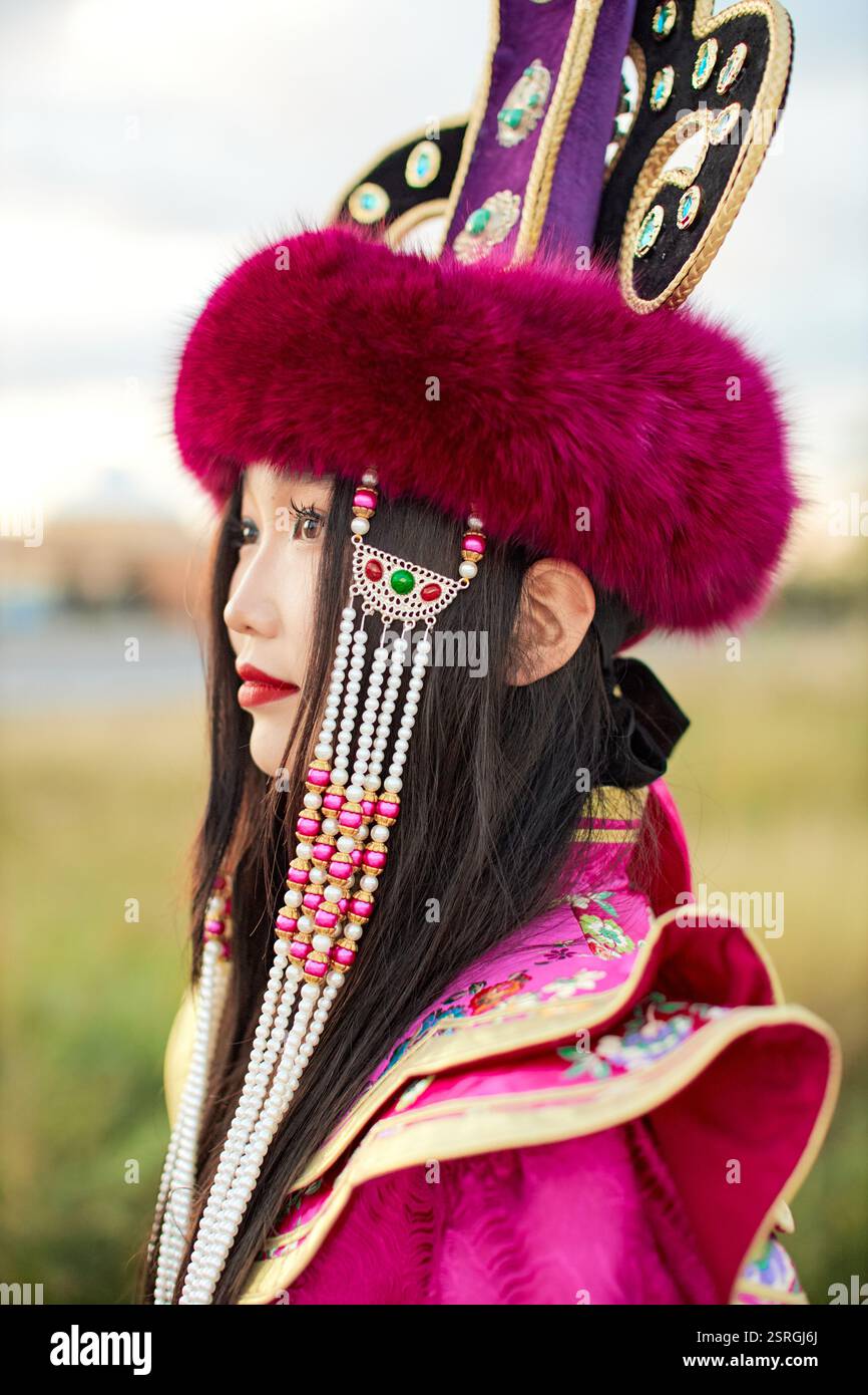 Mongolian girl wearing traditional costume of the Mongolian Ordos tribe ...