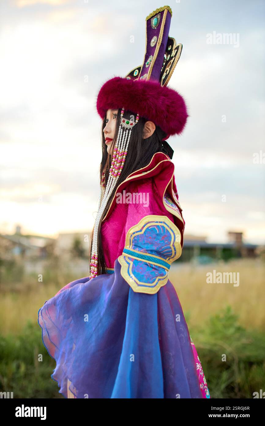 Mongolian girl wearing traditional costume of the Mongolian Ordos tribe ...