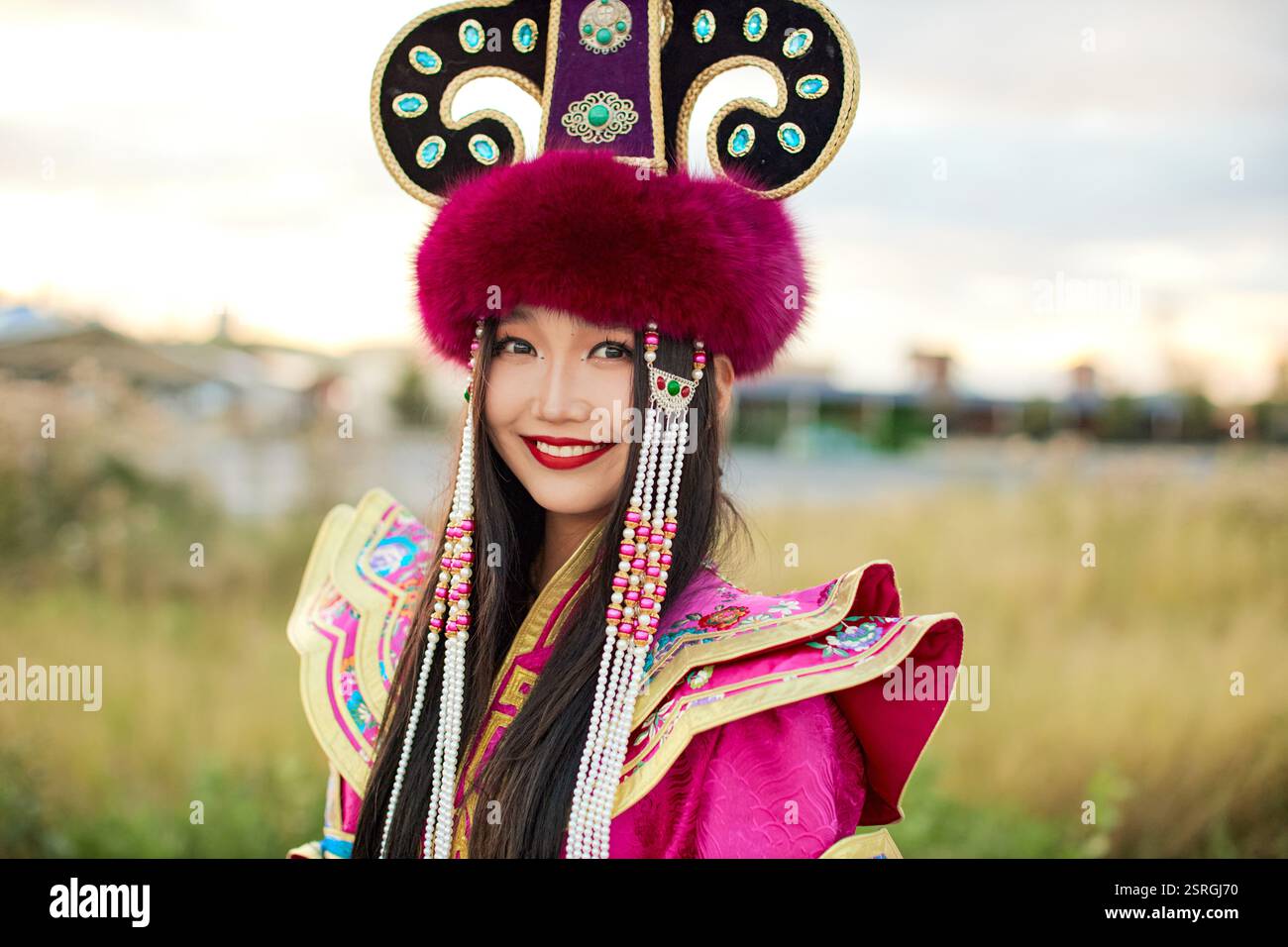 Mongolian girl wearing traditional costume of the Mongolian Ordos tribe ...