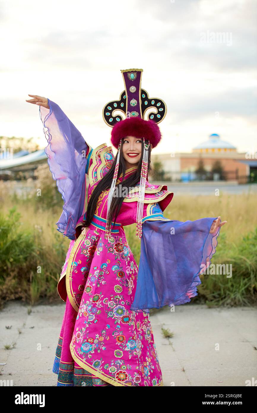 Mongolian girl wearing traditional costume of the Mongolian Ordos tribe ...