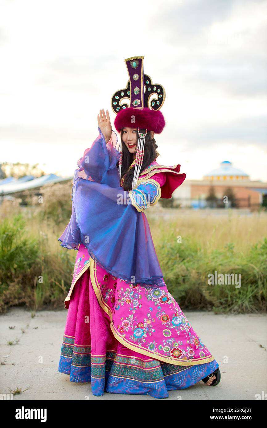 Mongolian girl wearing traditional costume of the Mongolian Ordos tribe ...