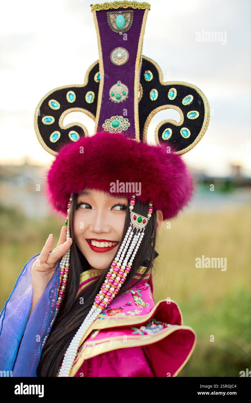 Mongolian girl wearing traditional costume of the Mongolian Ordos tribe ...