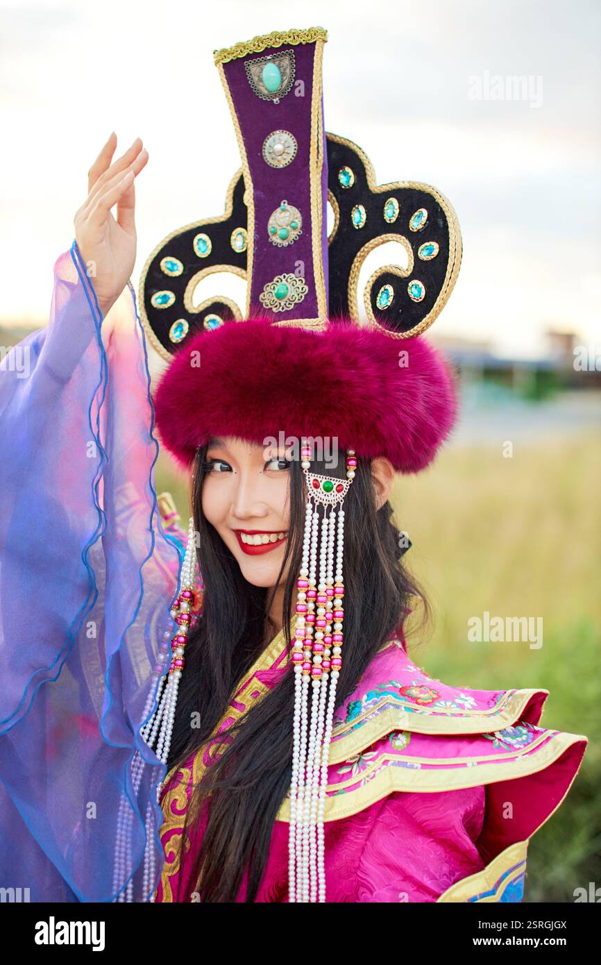 Mongolian girl wearing traditional costume of the Mongolian Ordos tribe ...