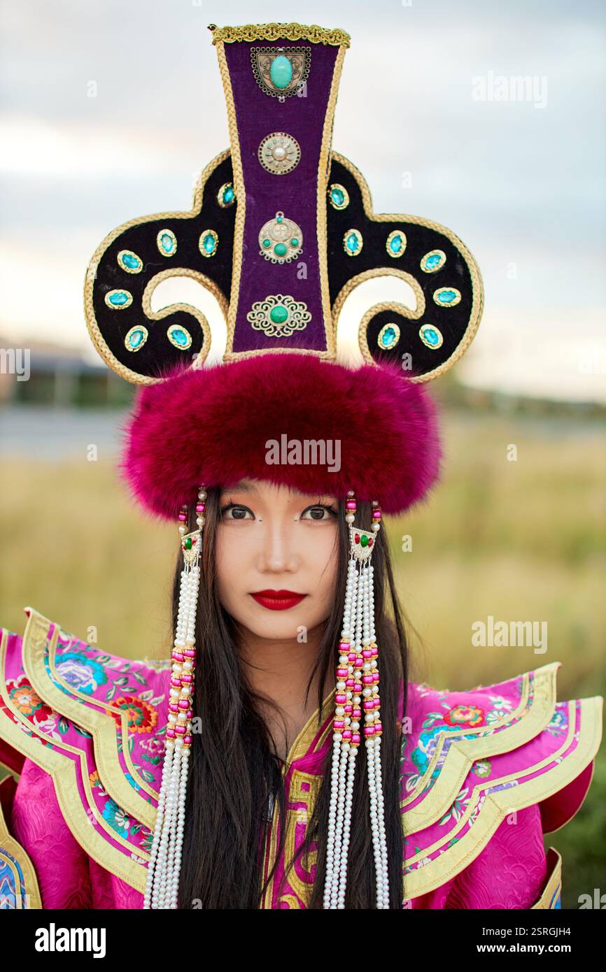 Mongolian girl wearing traditional costume of the Mongolian Ordos tribe ...