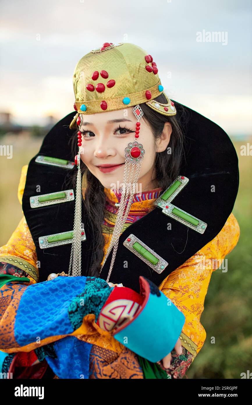 Mongolian girl wearing traditional costume of the Mongolian Ordos tribe ...