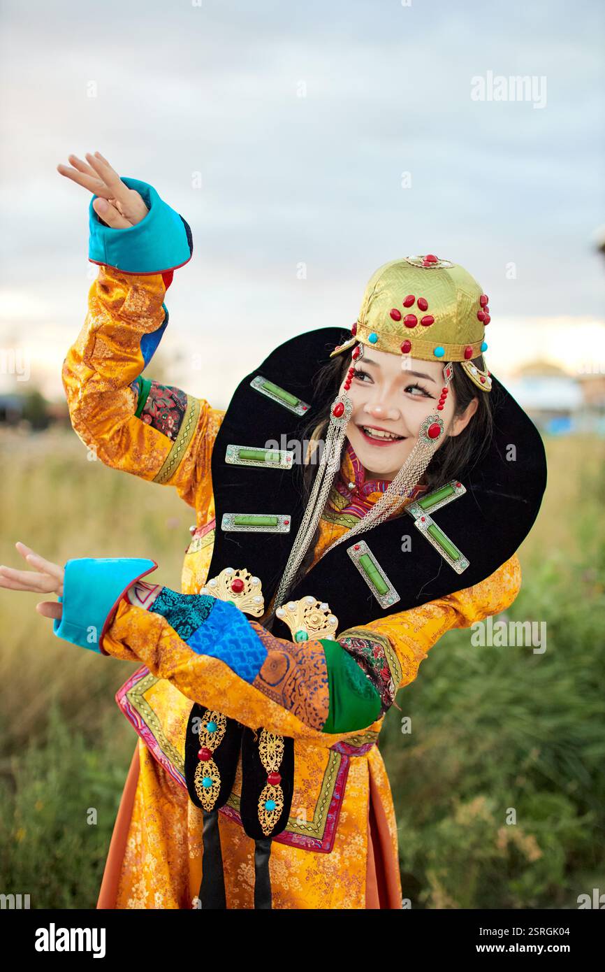 Mongolian girl wearing traditional costume of the Mongolian Ordos tribe ...