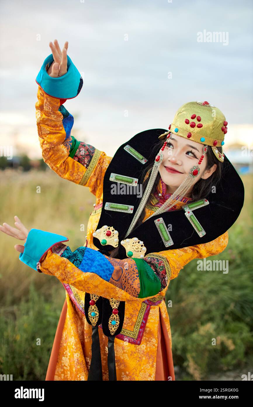 Mongolian girl wearing traditional costume of the Mongolian Ordos tribe ...