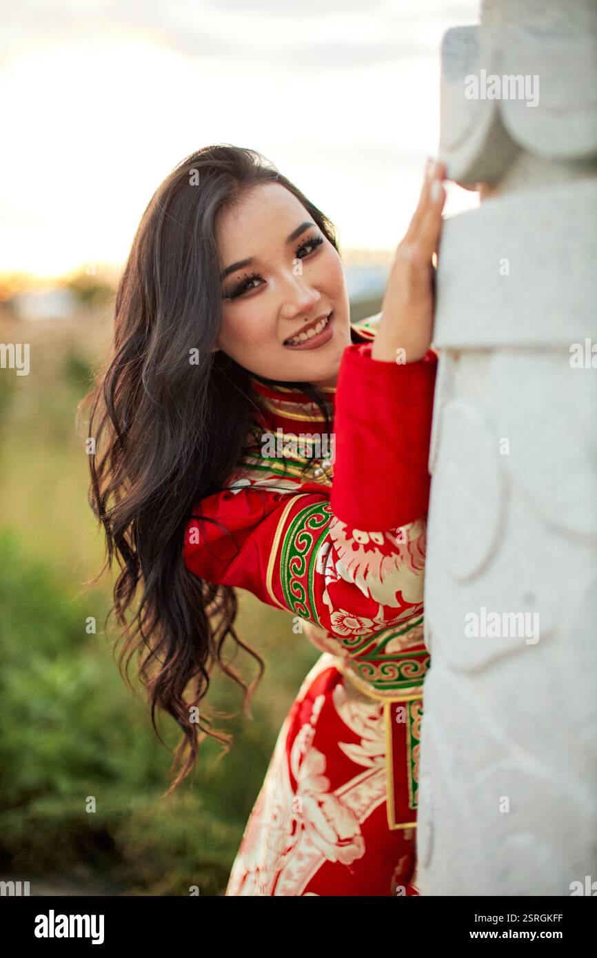 Mongolian girl wearing traditional costume of the Mongolian Ordos tribe ...