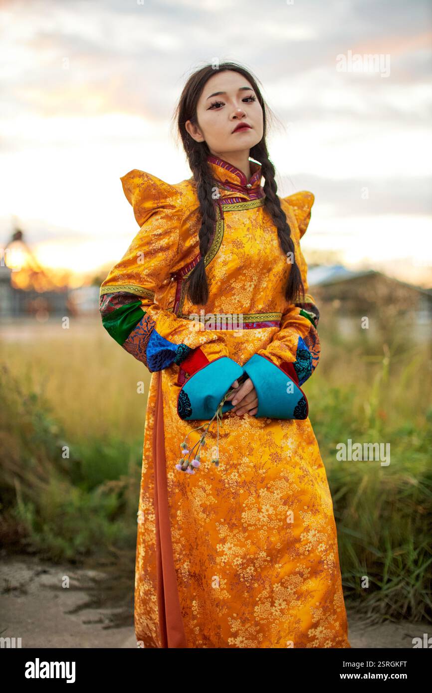 Mongolian girl wearing traditional costume of the Mongolian Ordos tribe ...