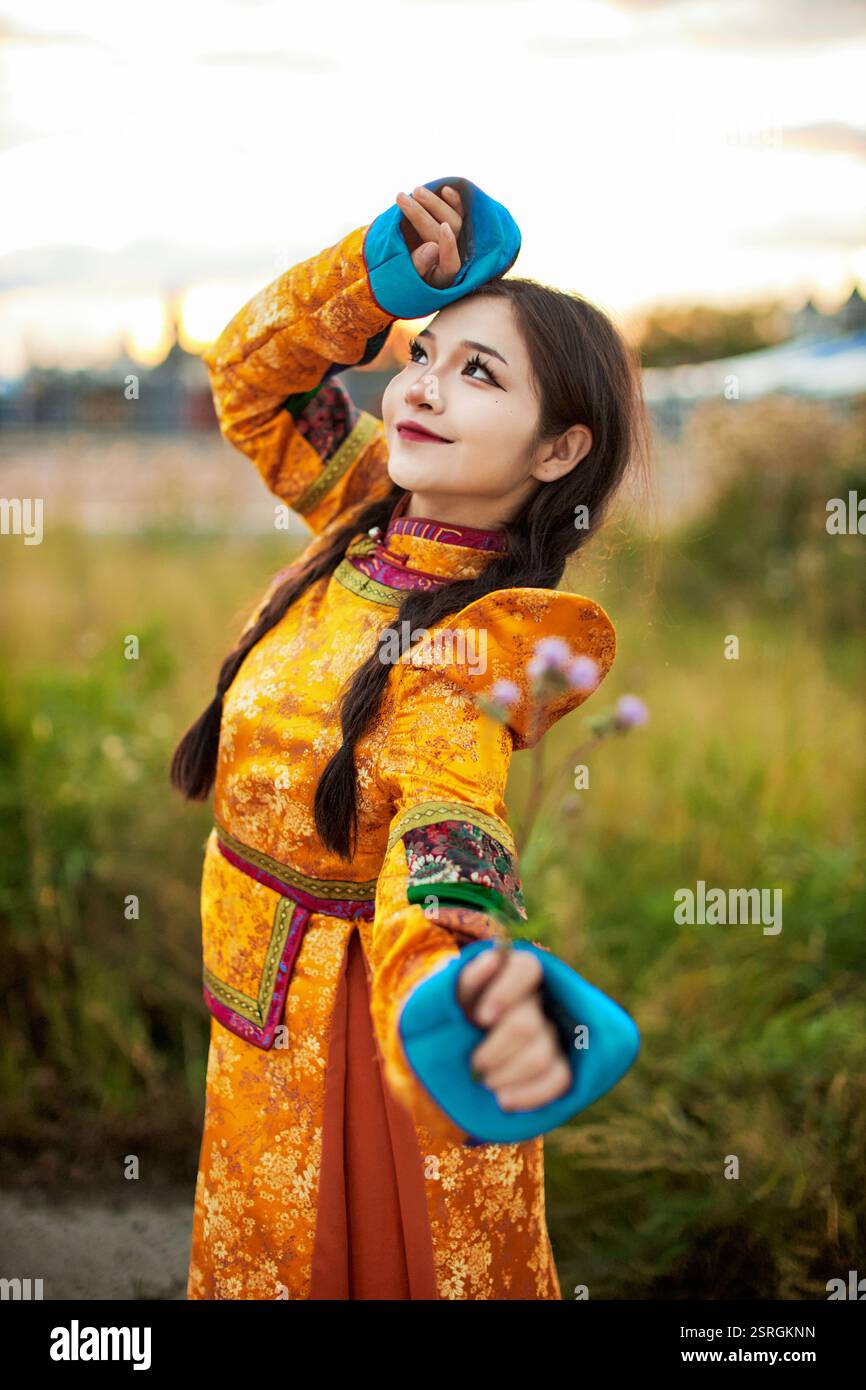Mongolian girl wearing traditional costume of the Mongolian Ordos tribe ...