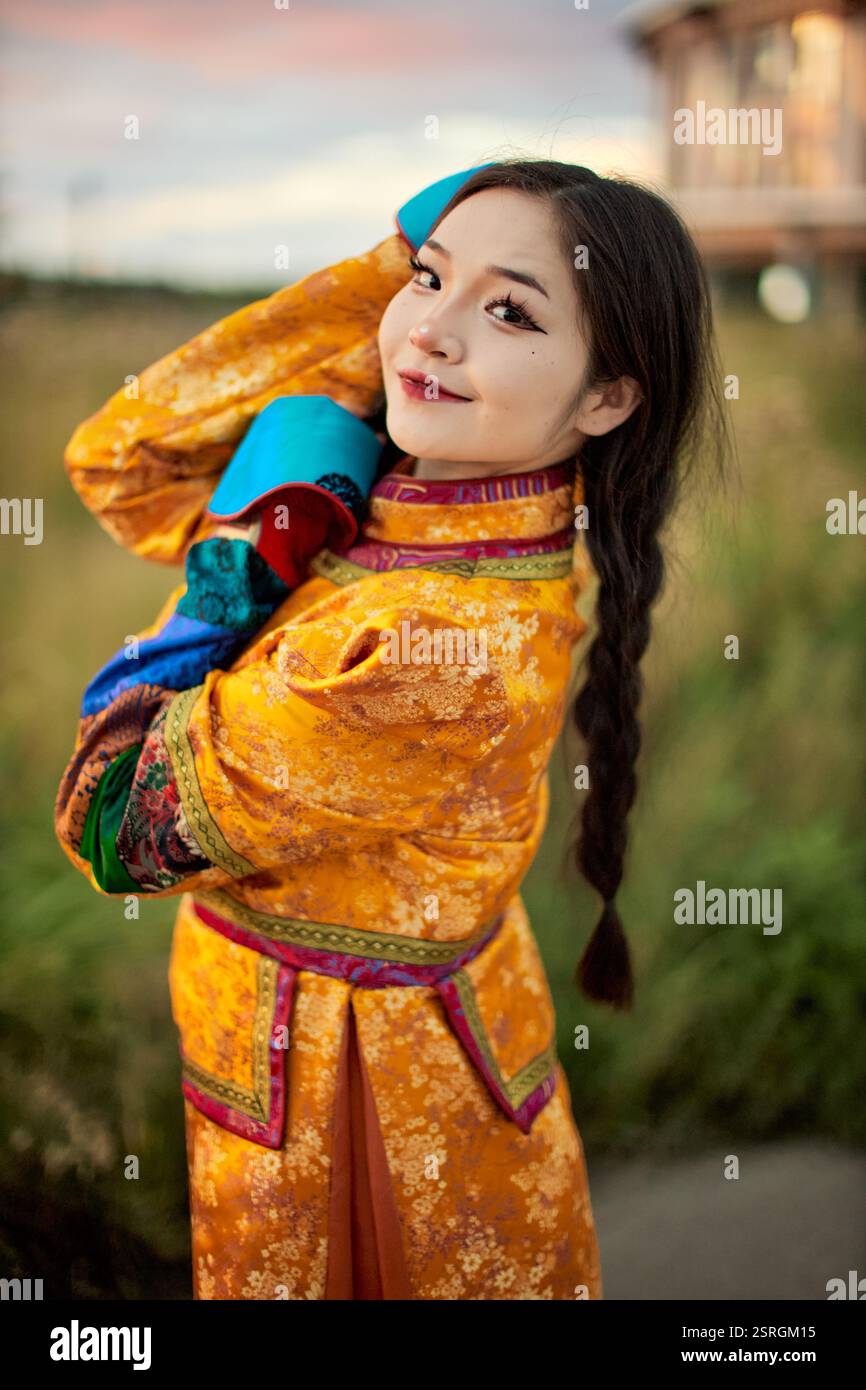Mongolian girl wearing traditional costume of the Mongolian Ordos tribe ...