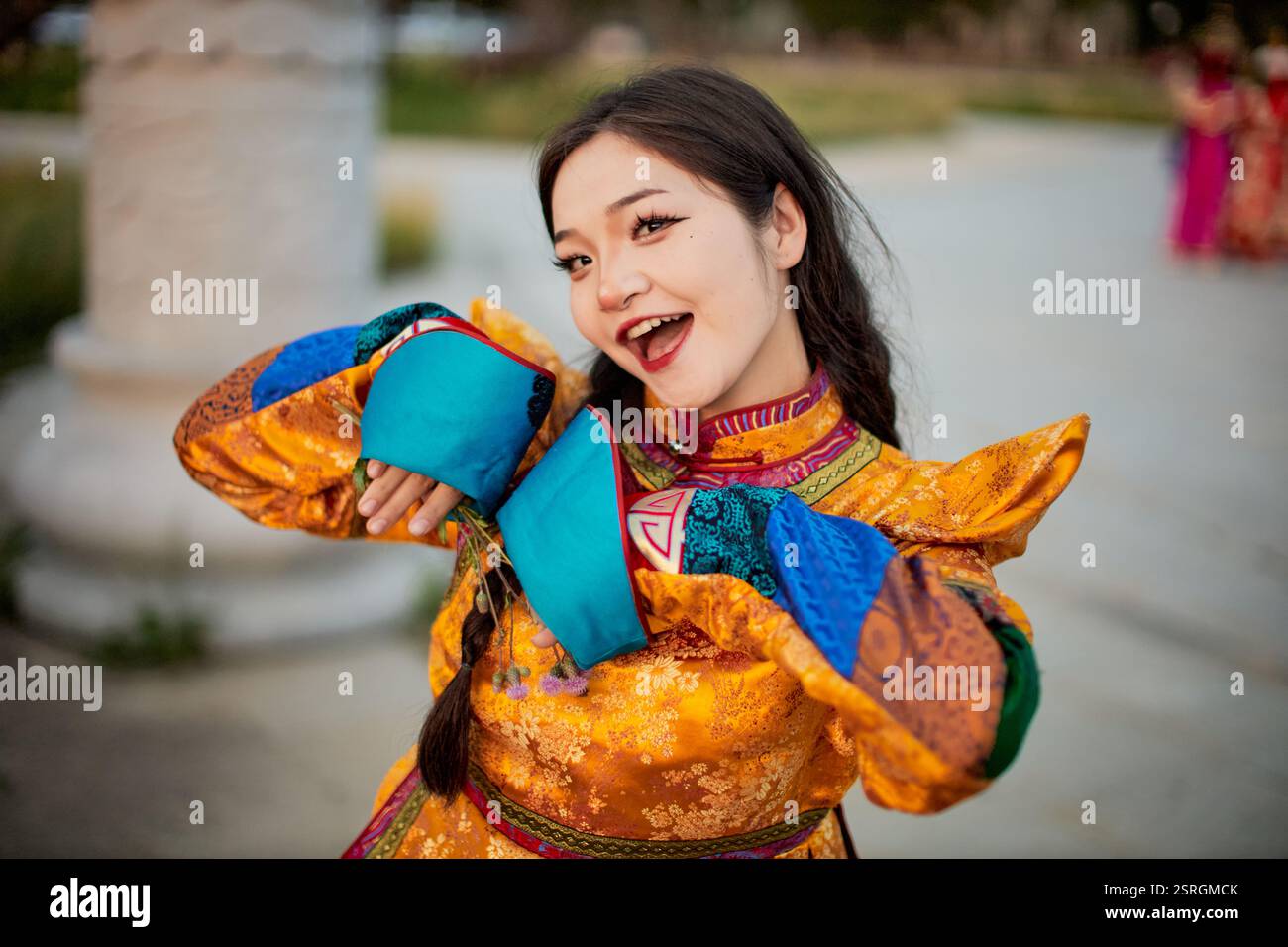 Mongolian girl wearing traditional costume of the Mongolian Ordos tribe ...