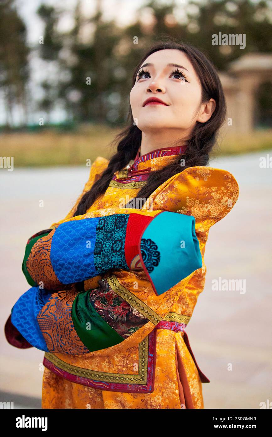 Mongolian girl wearing traditional costume of the Mongolian Ordos tribe ...