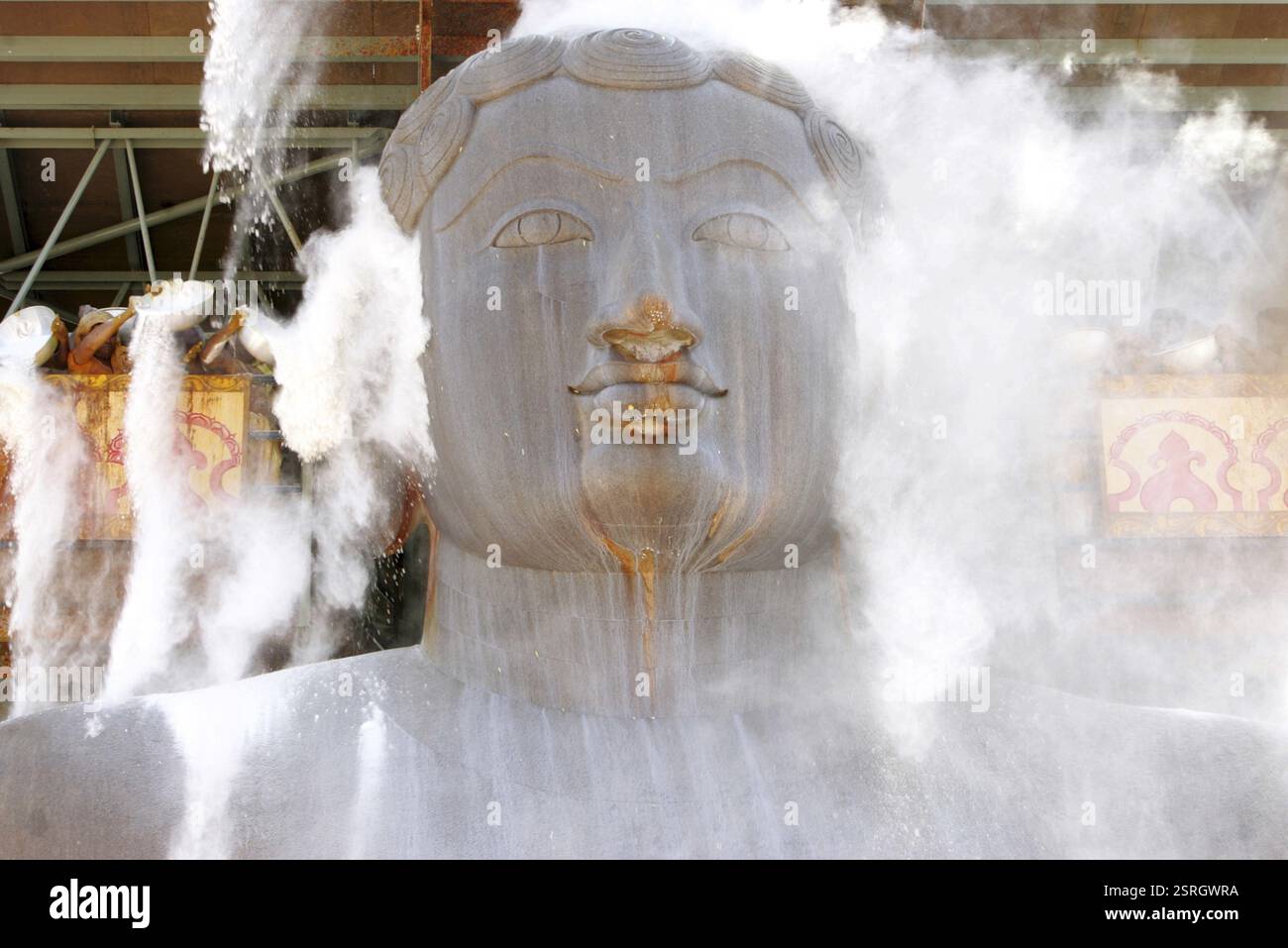Sandalwood powder sprinkled on eighteen meter high statue of bhagwan ...