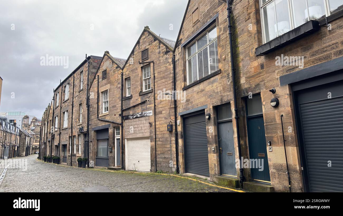 Old Victorian terrace buildings in Canning Street Lane, Edinburgh. Scottish stone classic houses. Cobbled street. Iconic Scottish street view - Smartphone Captured Stock Image