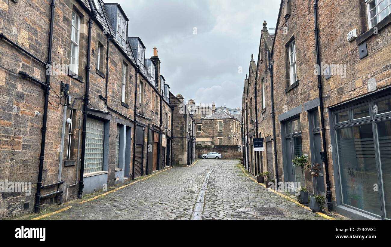 Old Victorian terrace buildings in Canning Street Lane, Edinburgh. Scottish stone classic houses. Cobbled street. Iconic Scottish street view - Smartphone Captured Stock Image