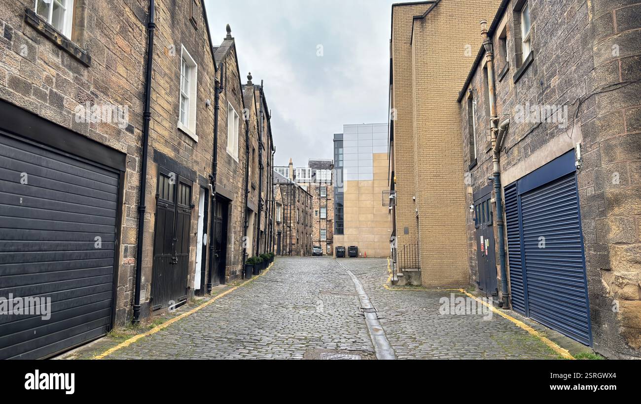 Old Victorian terrace buildings in Canning Street Lane, Edinburgh. Scottish stone classic houses. Cobbled street. Iconic Scottish street view - Smartphone Captured Stock Image