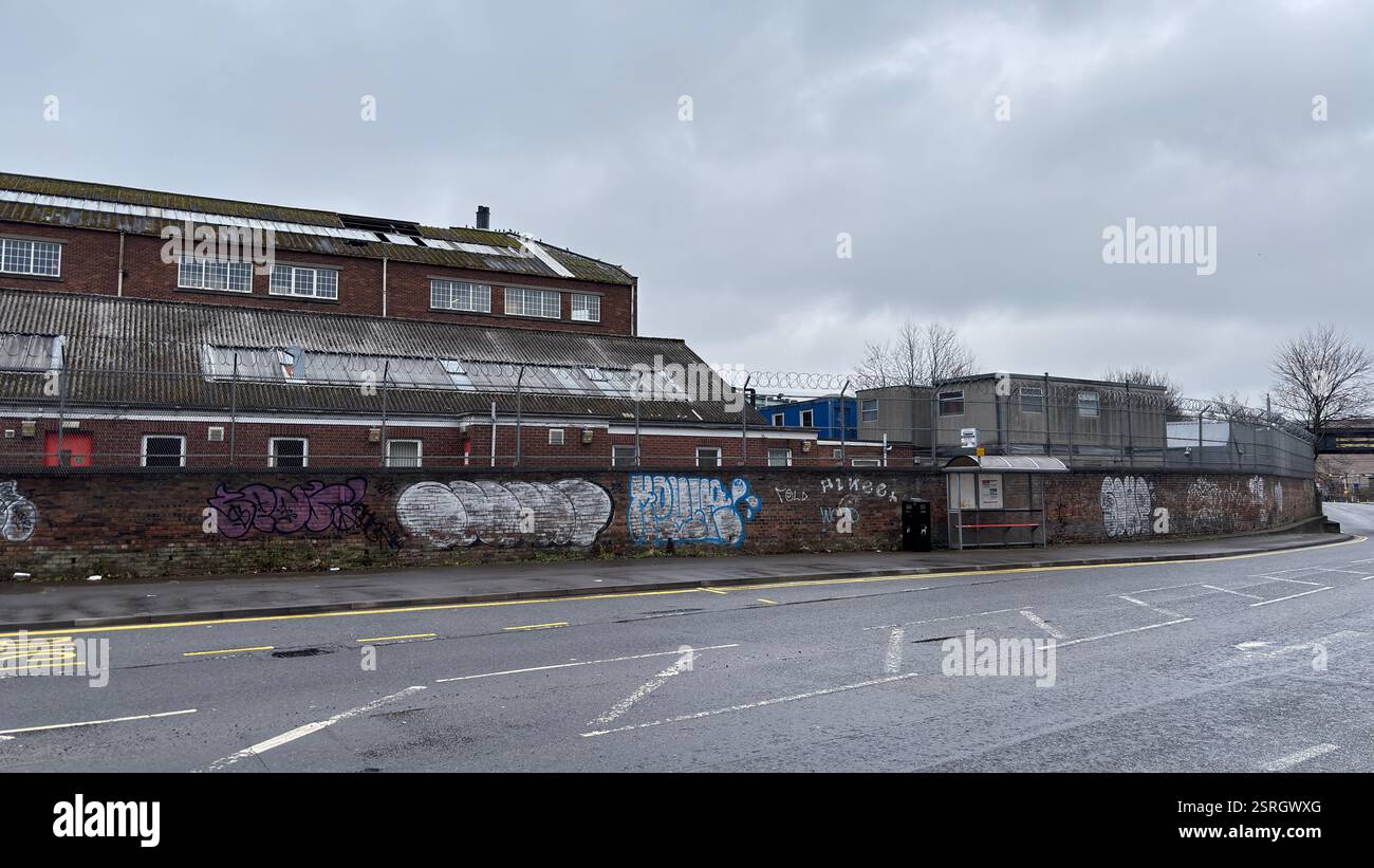 North British Distillery Building in Edinburgh. Grungy brick factory on a dull overcast day. Dirty and grimy industrial factory - Smartphone Captured Stock Image