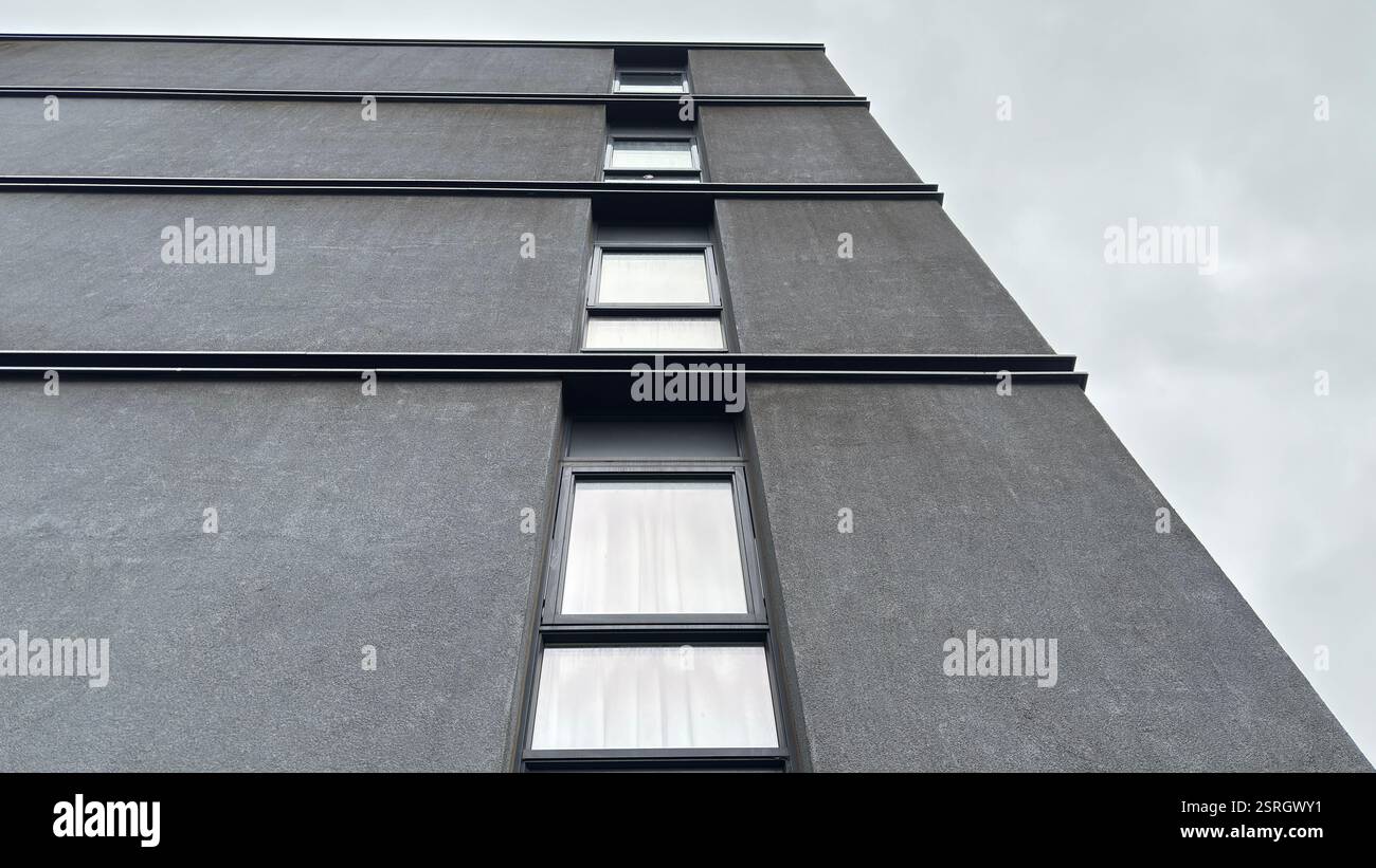 Modern brutal architecture flat living in the middle of the city of Edinburgh. Grungy urban architecture. Modern brutal concrete structure - Smartphone Captured Stock Image