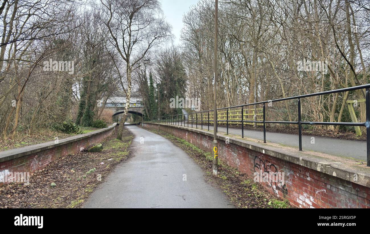 Old Pinkhill railway station cycle path route to city centre of Edinburgh. Old abandoned railway track. Public footpath. - Smartphone Captured Stock Image