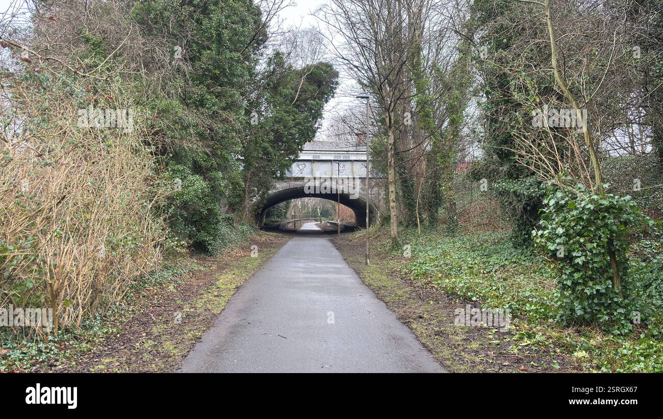 Old Pinkhill railway station cycle path route to city centre of Edinburgh. Old abandoned railway track. Public footpath. - Smartphone Captured Stock Image