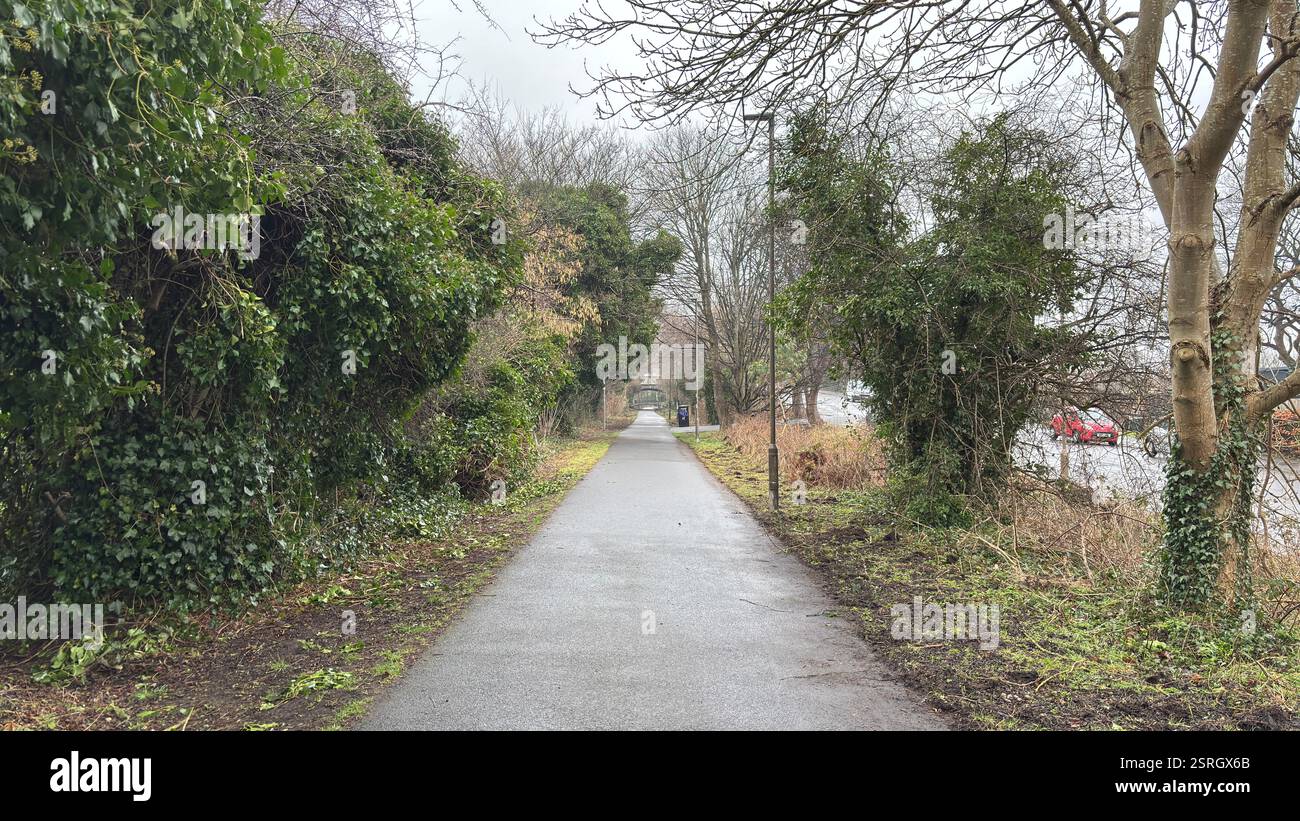 Old Pinkhill railway station cycle path route to city centre of Edinburgh. Old abandoned railway track. Public footpath. - Smartphone Captured Stock Image
