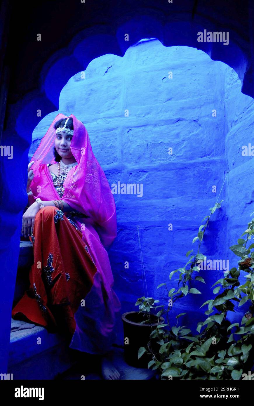 Indian girl sitting on house hi-res stock photography and images - Alamy