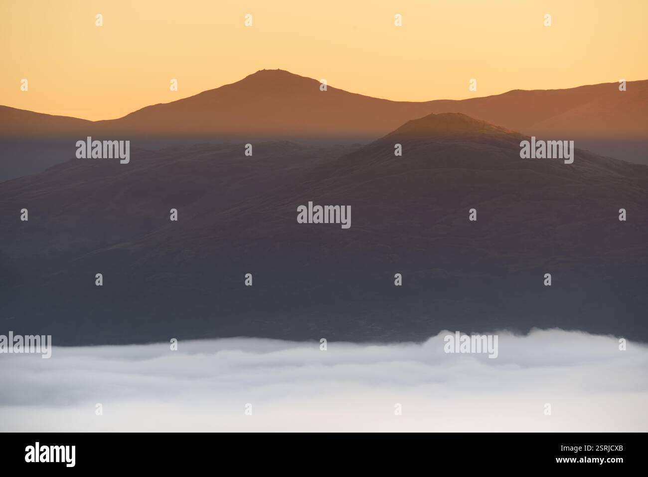 Morning cloud inversion with golden light on Wansfell Pike and Ill Bell ...