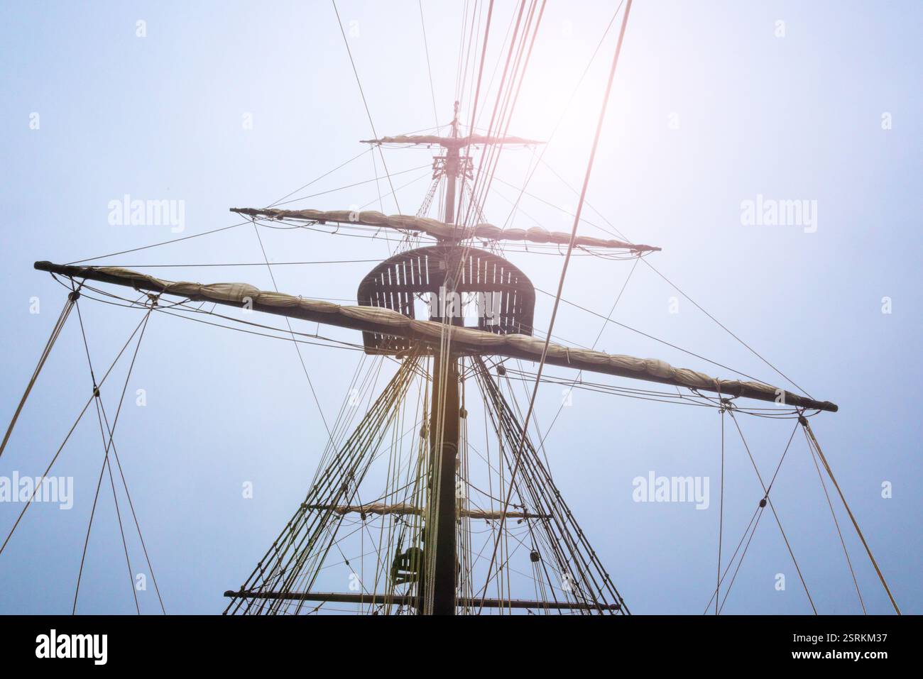 Mast and rigging of the ship silhouetted by bright sunlit sky Stock ...