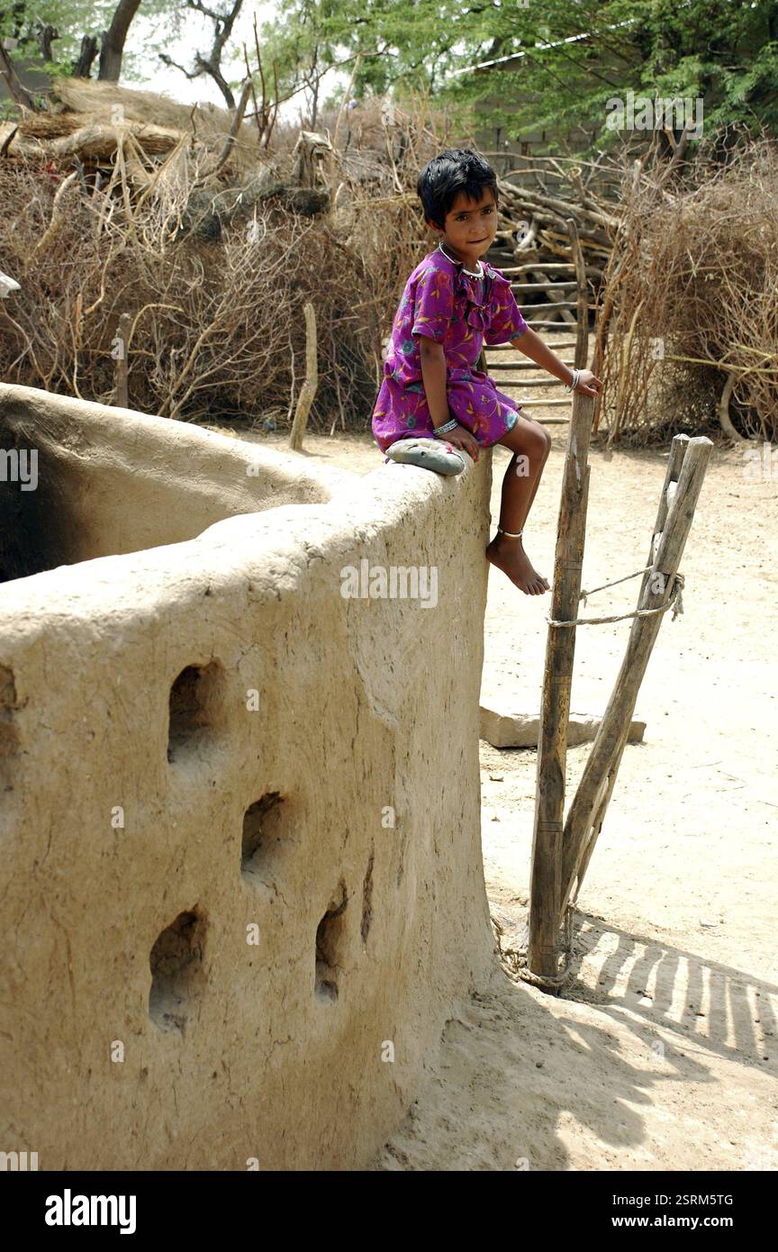 Indian girls sitting on a wall hi-res stock photography and images - Alamy