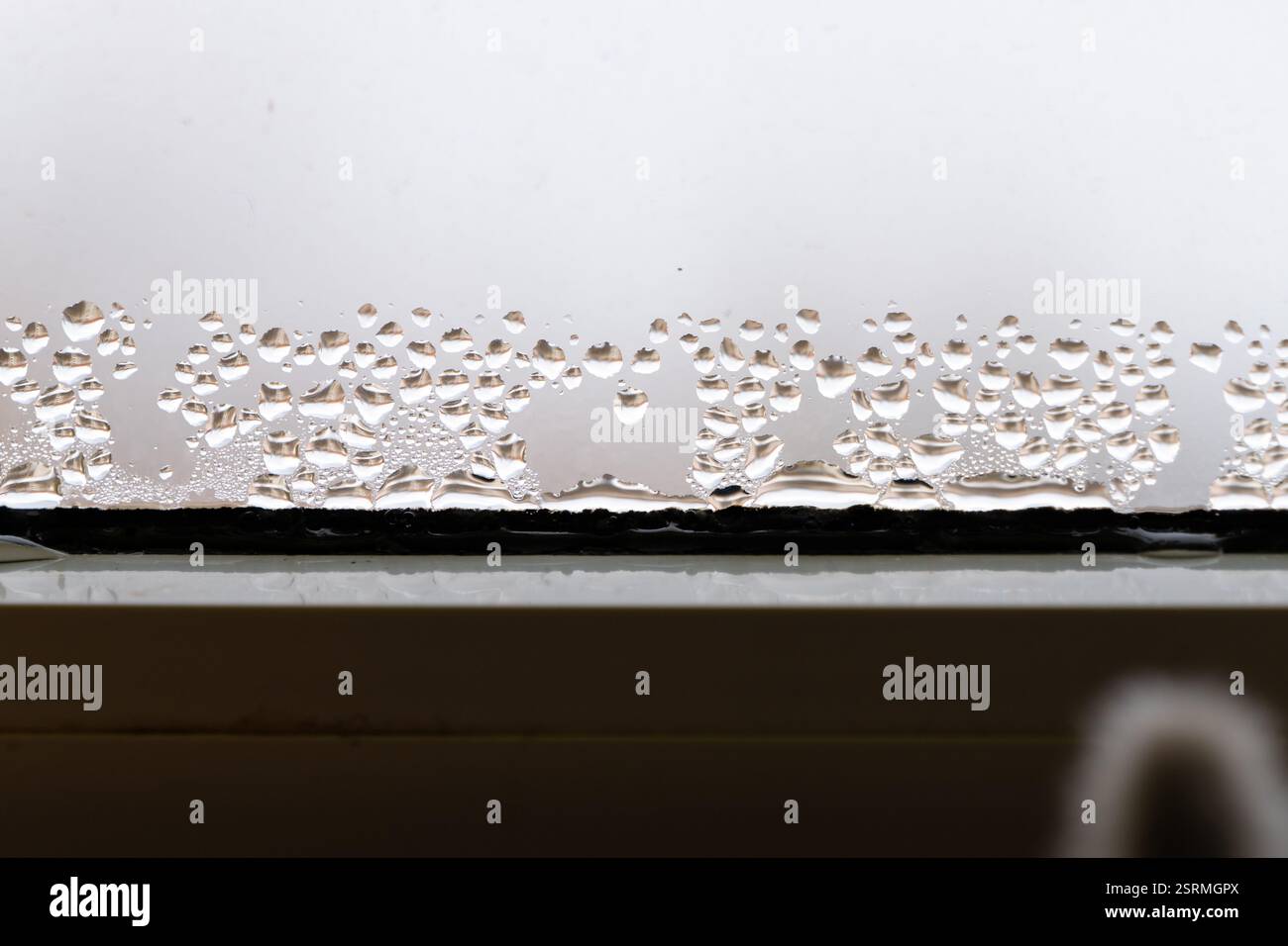 Condensation on the window. Water droplets on a cold glass surface ...