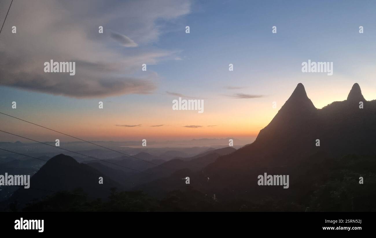 The night sky stretches infinitely, a deep canvas adorned with soft, drifting clouds and a single radiant star twinkling like a cosmic beacon. - Smartphone Captured Stock Image