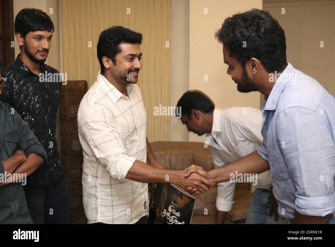 Tamil film actor Surya (C) during the unveiling of Tamil film ...