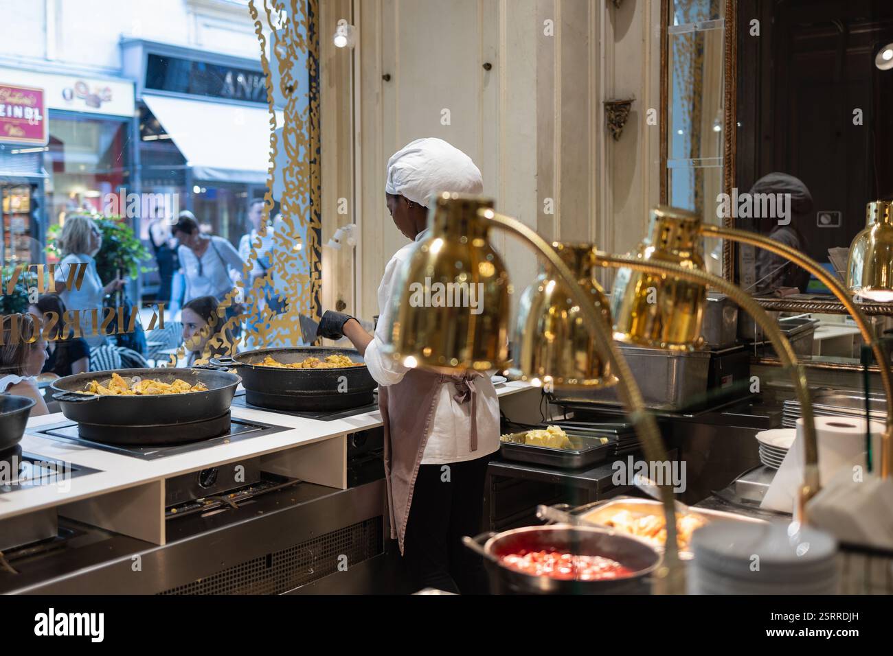The Iconic Demel Cafe in Vienna, Workers engaged in activities inside ...