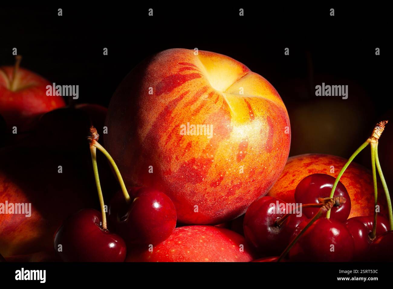 peach fruit mix on black background Stock Photo
