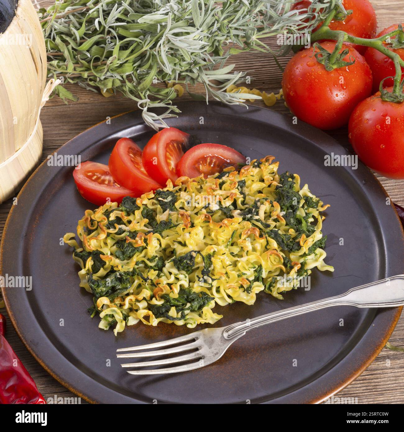 Spinach noodle crowd au gratin Stock Photo