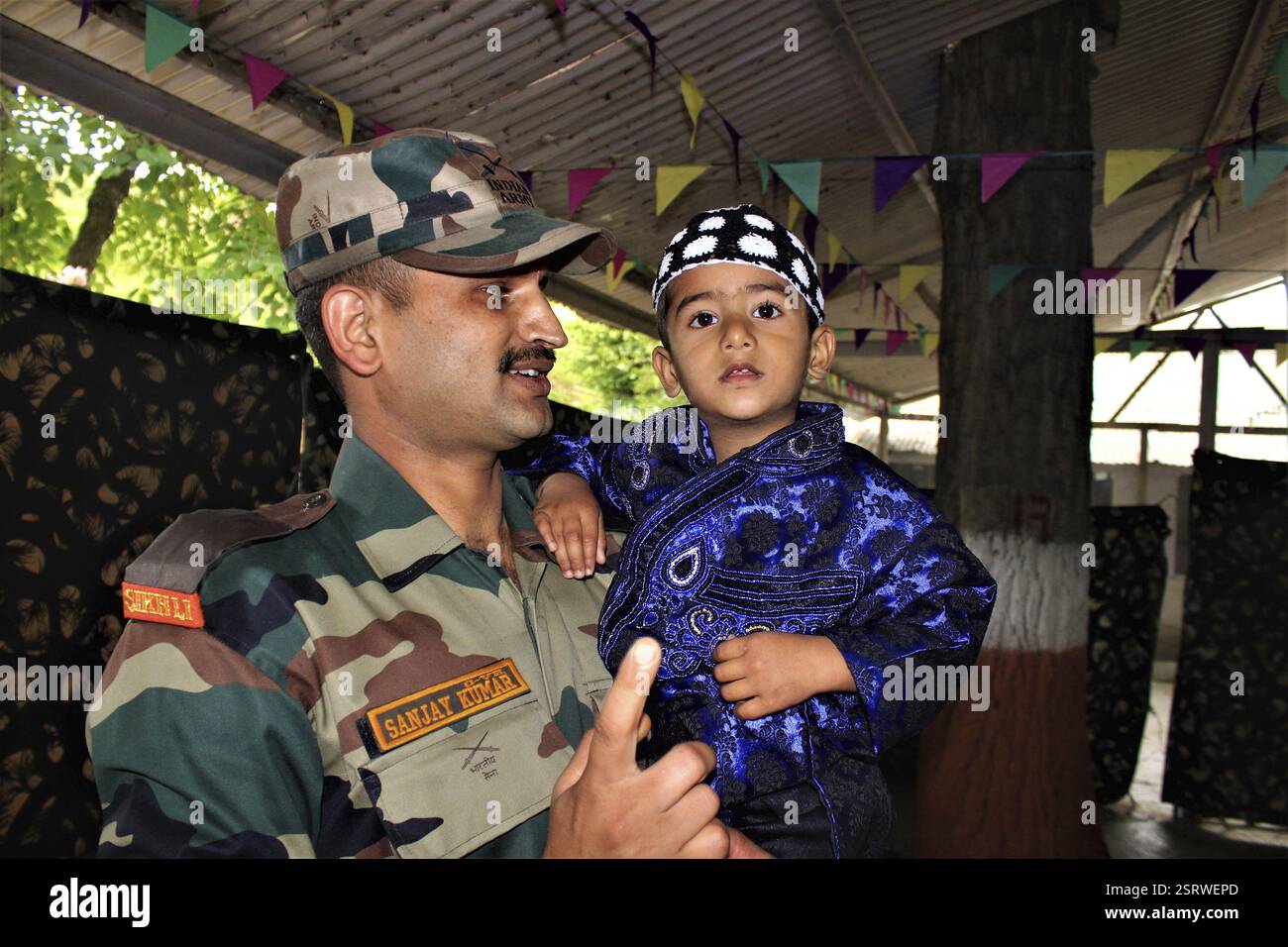 Army man with child during Jashn e Wular Festival, Kashmir, India, Asia ...