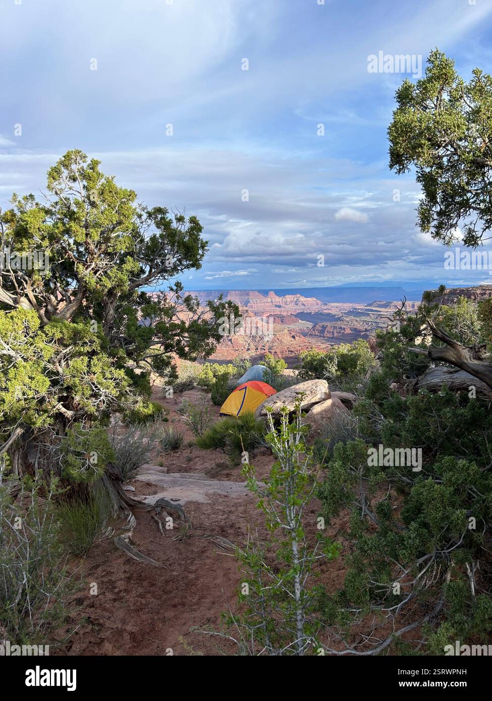 Tents on a ledge overlooking Canyonlands - Smartphone Captured Stock Image