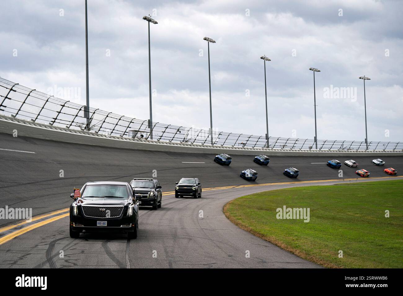 President Donald Trump rides in the presidential limousine known as ...