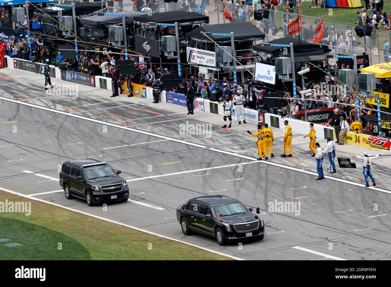 President Donald Trump rides in the presidential limousine known as ...