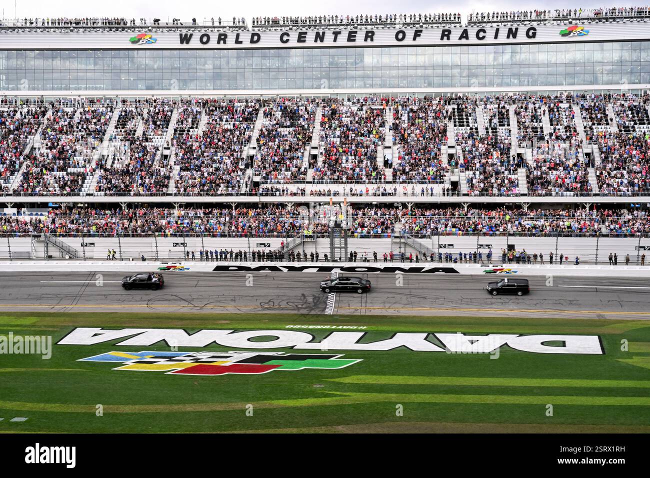 President Donald Trump rides in the presidential limousine known as ...