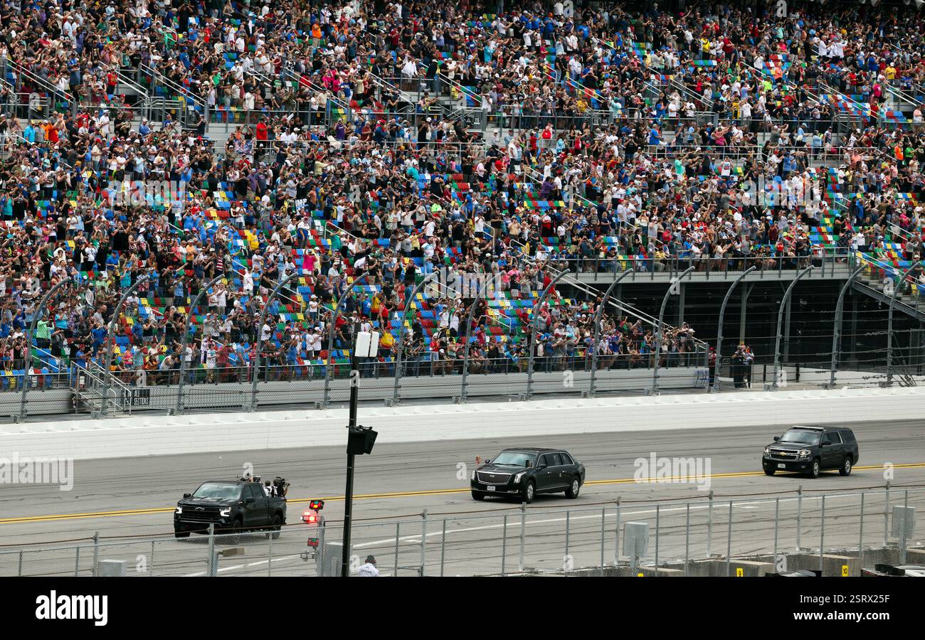President Donald Trump rides in the presidential limousine known as ...