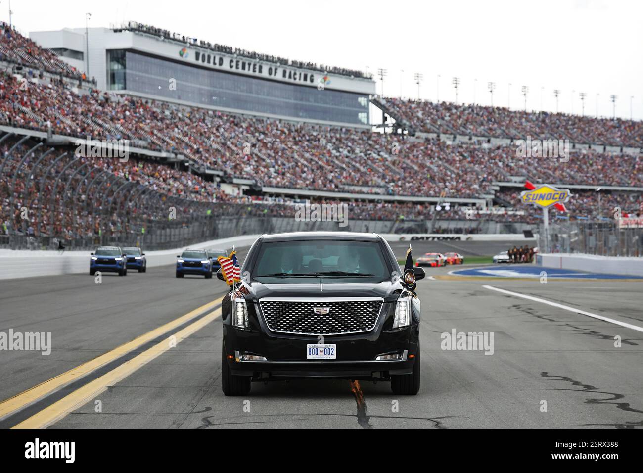 President Donald Trump rides in the presidential limousine known as ...