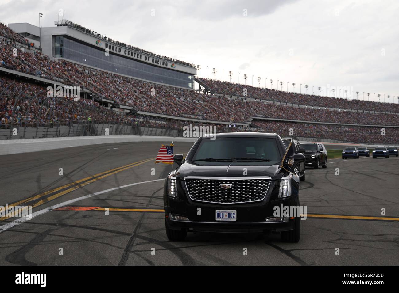 President Donald Trump rides in the presidential limousine known as ...